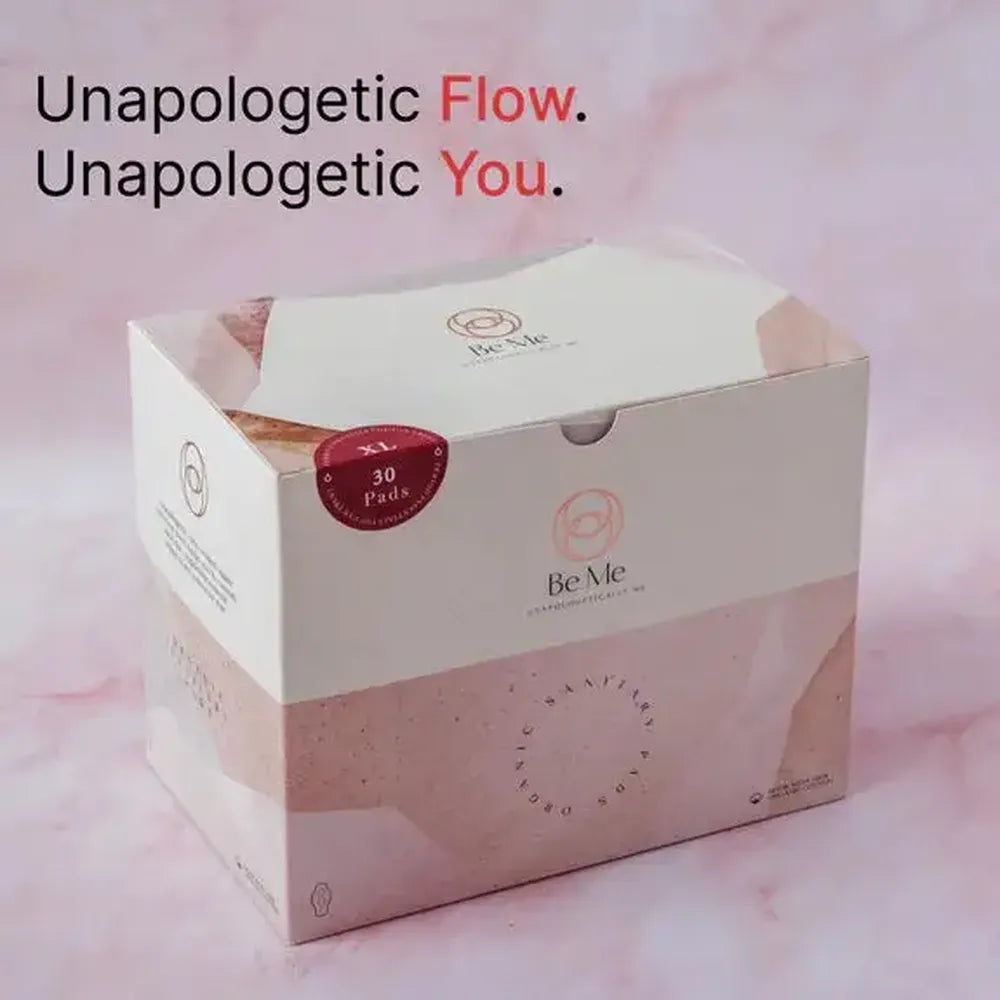 Box of 'Be Me' rash-free sanitary pads with a pink and white design on a pink background.