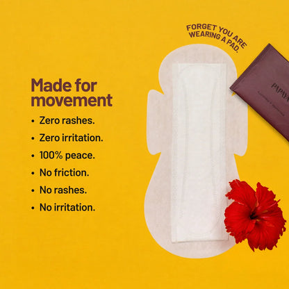 Menstrual pad with a red flower on a yellow background, featuring text about product benefits.
