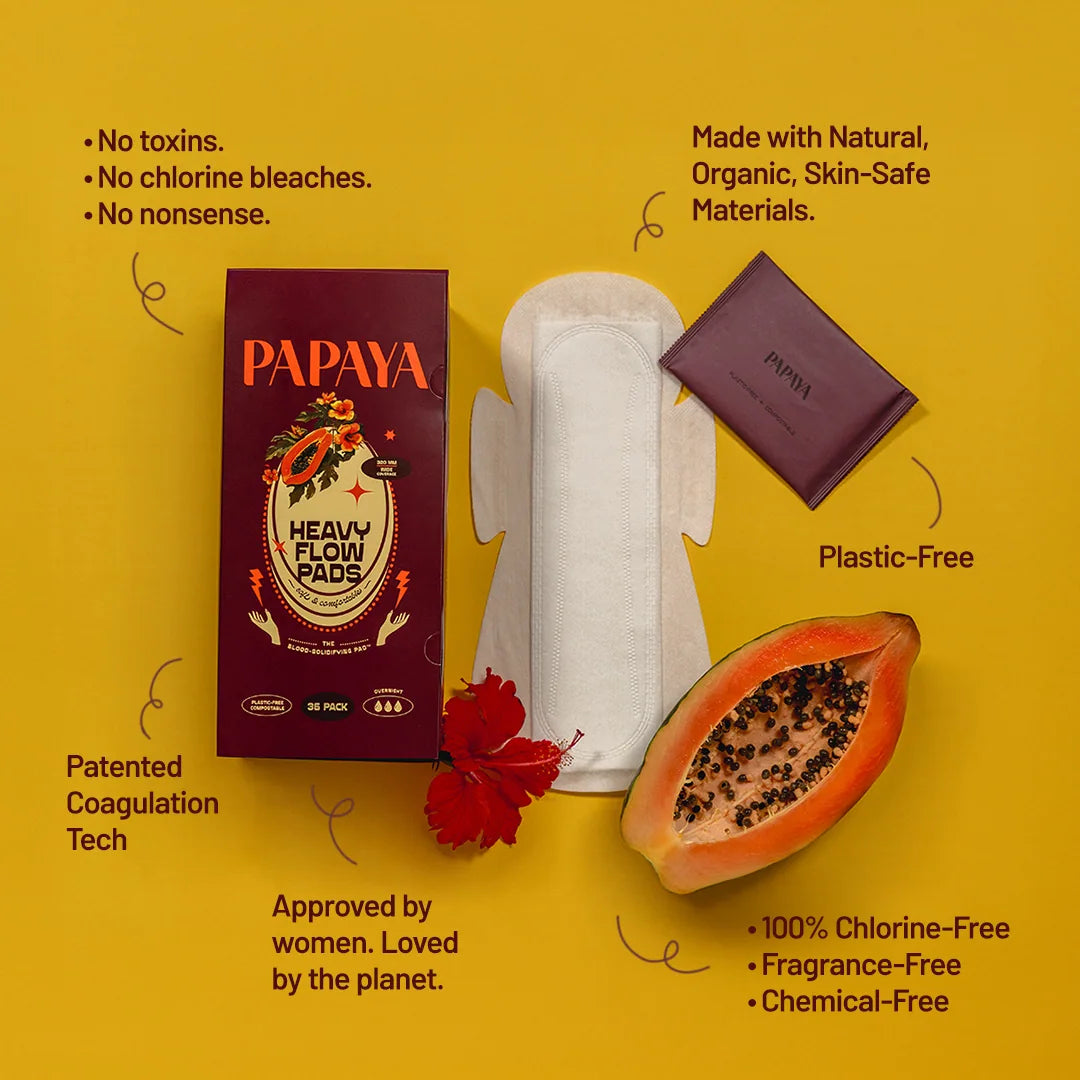 Papaya heavy flow pads with packaging on a yellow background