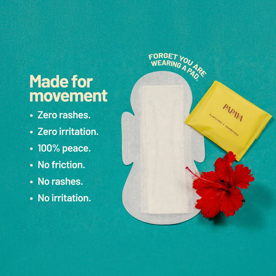 Papaya pad with packaging and red flower on a teal background