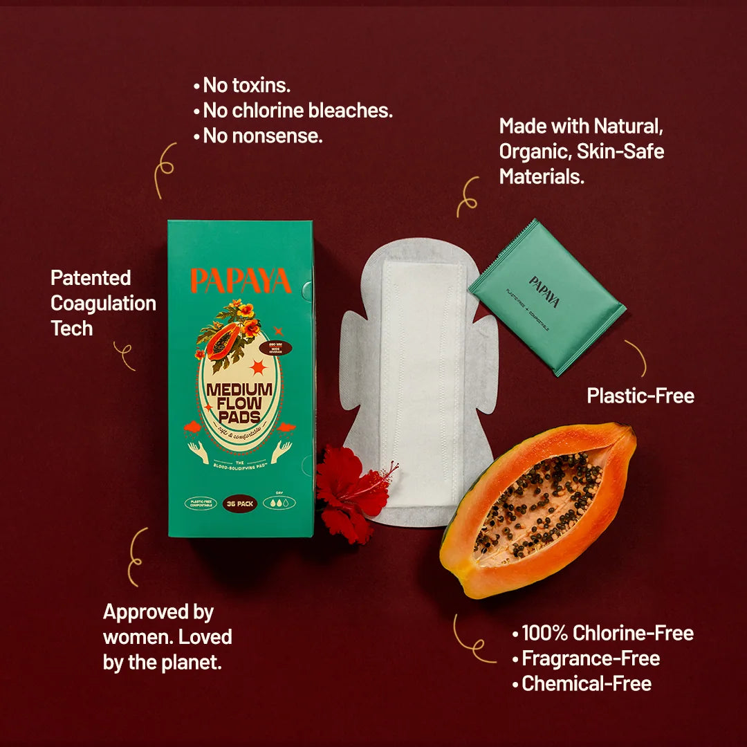 Papaya menstrual product packaging with features on a red background