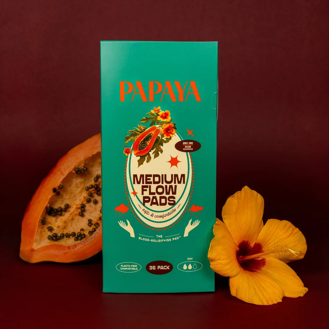 Box of Papaya medium flow pads with a papaya and flower on a dark background