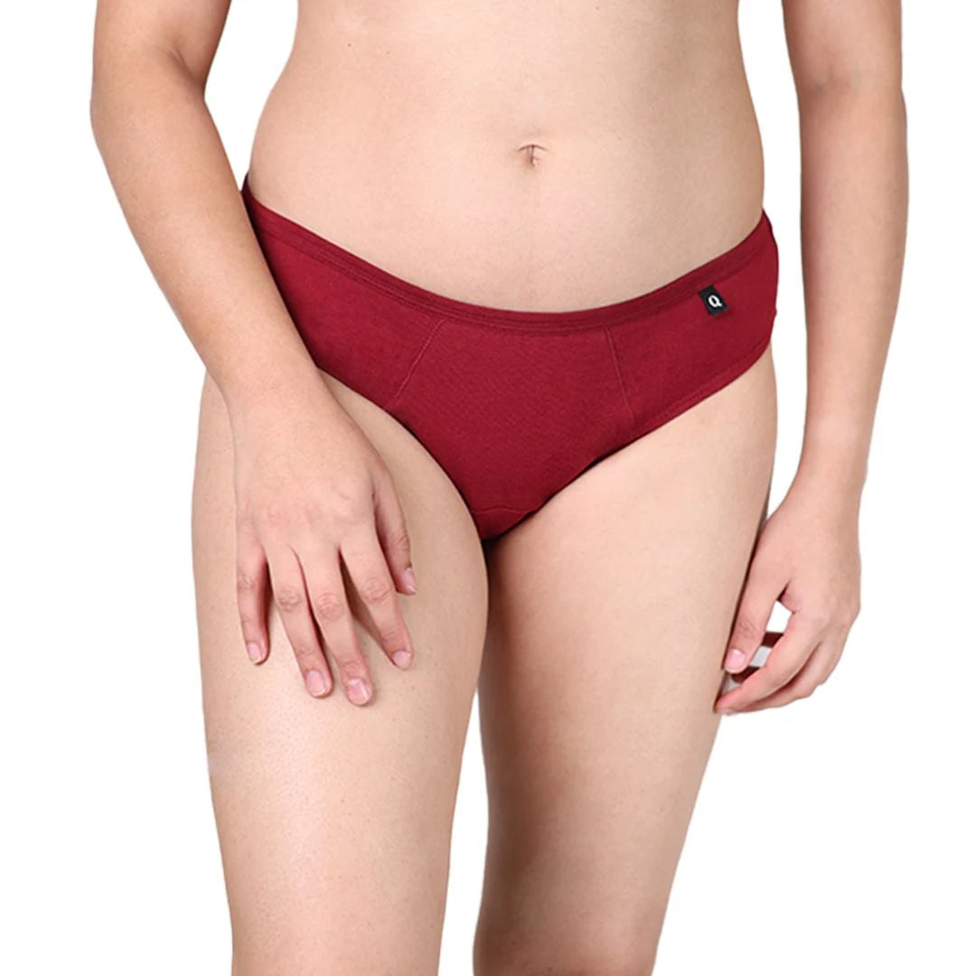 Red period underwear worn by a person on a white background