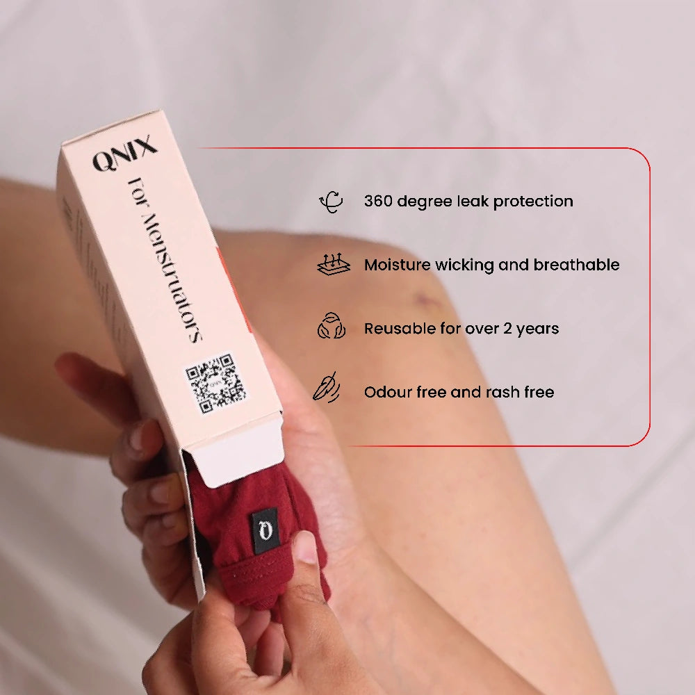 Person holding a box of QNIX Period Underwear with product features listed.